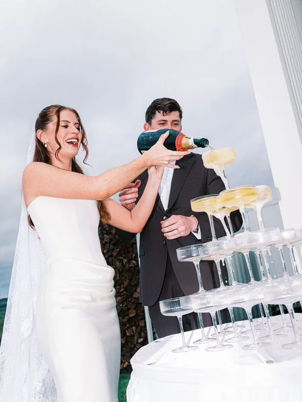 Champagne tower celebration at Alex and Will's wedding at Maroon Hill Estate