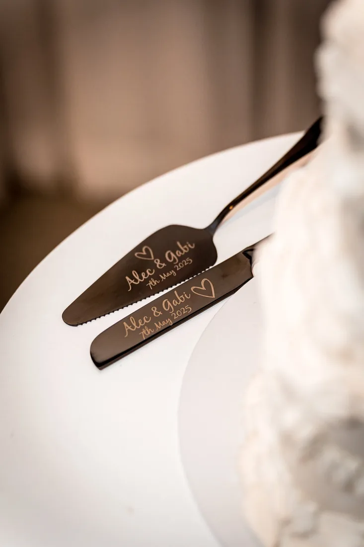 Engraved cake server and knife set reading Alec and Gabi, 7th May 2025