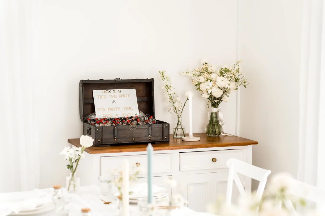 Wooden treasure chest wedding favour box styled with a 