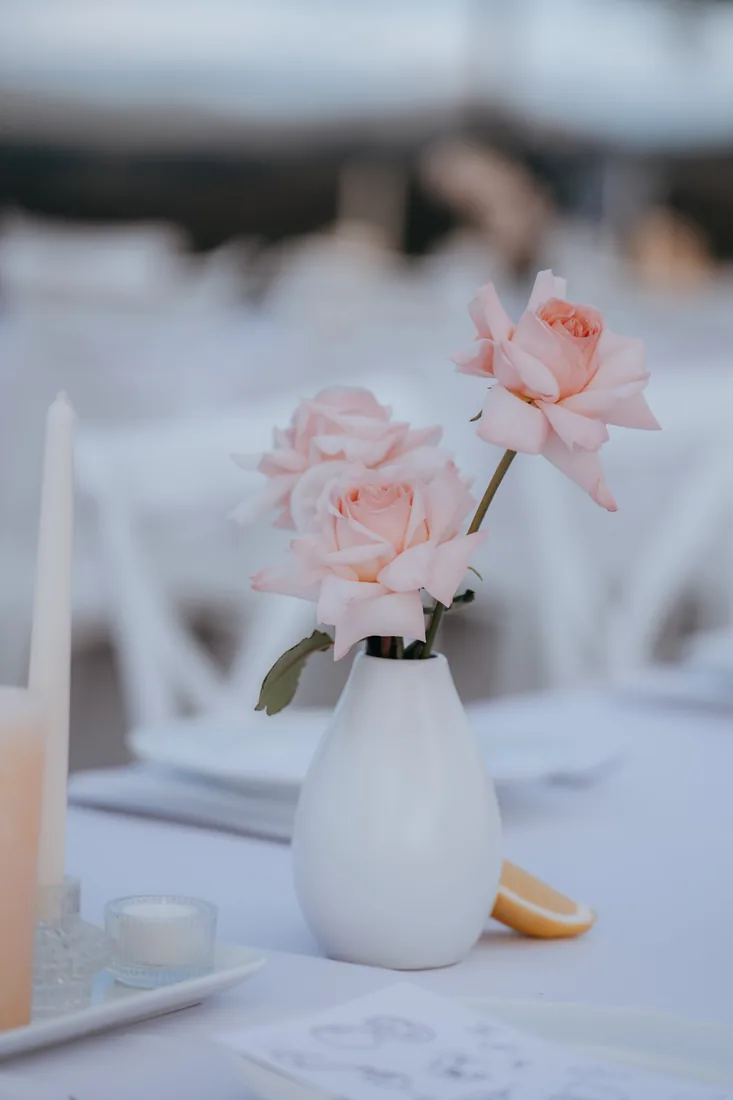 Pink rose centrepiece on the reception table at Maroon Hill Estate