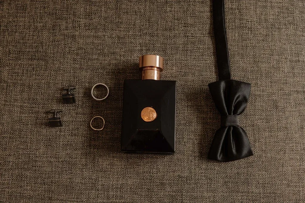 Groom's details flat lay at Karly and Anru's wedding at Maroon Hill Estate