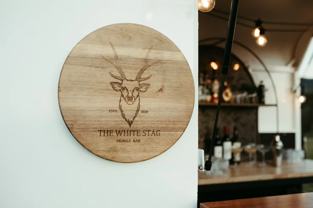The White Stag mobile bar signage mounted beside the fully stocked bar