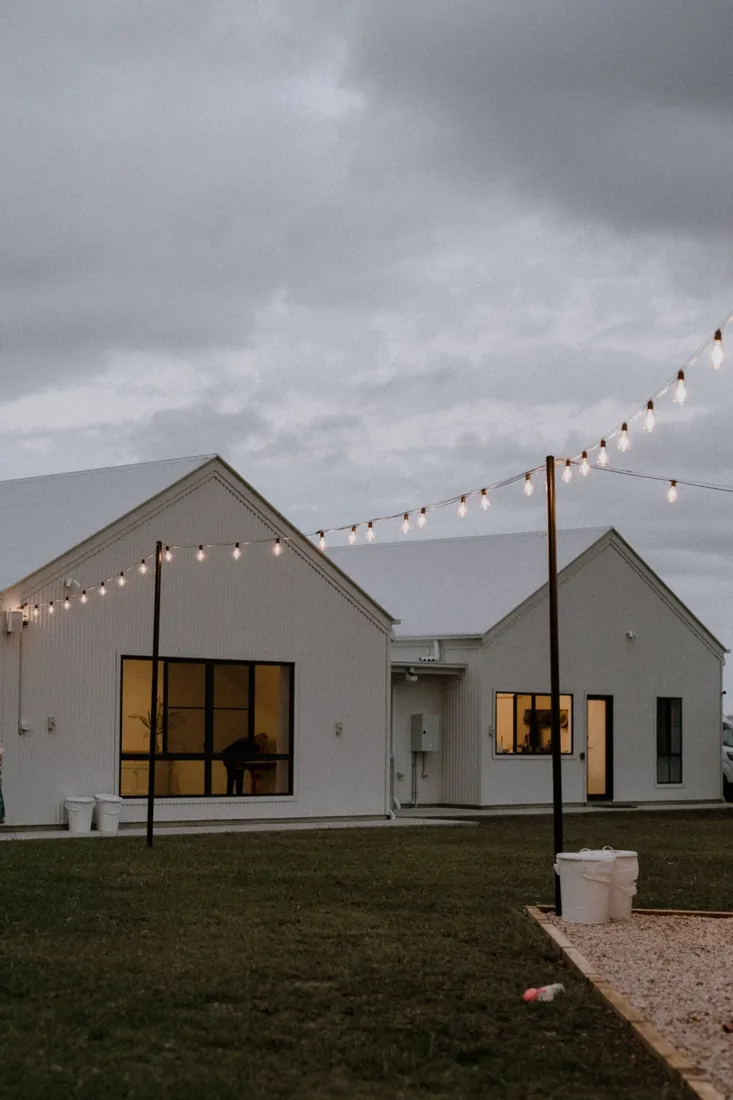 Maroon Hill Estate venue lit up at dusk with festoon lighting