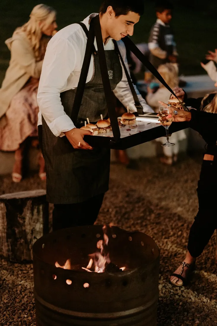 Canapés being served by the fire pit at Maroon Hill Estate